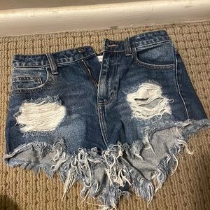 High waisted ripped blue jeans distressed